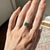 Timeless elegance meets natural beauty in the Naksha Colombian Emerald Ring, a luxurious piece designed to captivate. This...