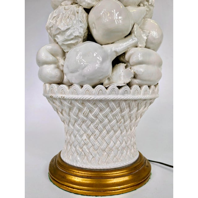 A classic porcelain Italian topiary of fruit and vegetable lamp with a brass base. Oval shaped and does not come with shade
