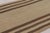 Handwoven in wool, this 5x9 contemporary Rez kilim features a natural beige field framed by rich brown vertical stripes....