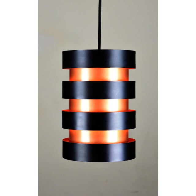 A striking Eiffel pendant designed by Jo Hammerborg for Fog & Mørup, Denmark, in 1963 and produced during the 1960s. The...