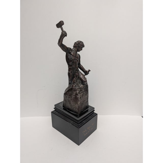 This item is the "Self Made Man" bronze sculpture by artist Bobbie Carlyle, depicting a figure carving himself out of a...