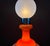 Large Murano glass floor lamp, no label remaining, with light emitting both from the top and from the lower part. Orange...