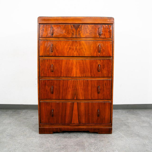 Beautiful highboy dresser in a burl walnut with metal handles. Unknown American maker.