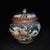 A beautiful pair of Chinese Famille Rose porcelain covered jars. The white ground is finely hand-painted with the classic...