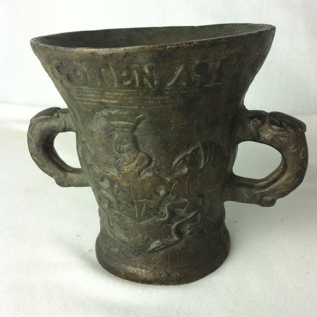 This heavy antique lead mortar is German. It has a gorgeous texture. The carved details, including a crest/coat of arms on...