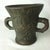 This heavy antique lead mortar is German. It has a gorgeous texture. The carved details, including a crest/coat of arms on...