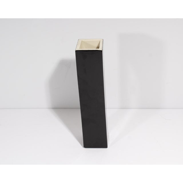 A 1992 Postmodern ceramic vase designed by the American designer Michael Duvall (1950-2004). Black and white striping is...