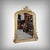 This superb mirror with a gilded wood and stucco pediment, crafted in the Louis XV style, features a finely detailed frame...