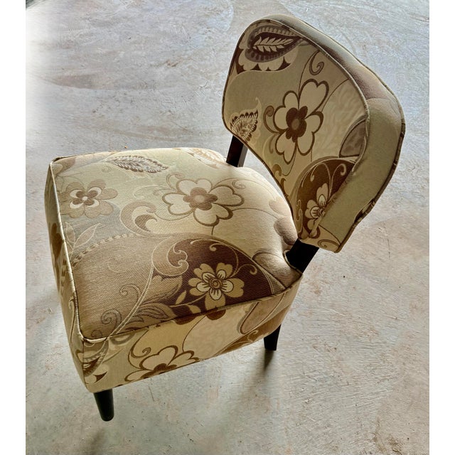 This slipper chair embodies design elements from Art Deco, Hollywood Regency and Mid-Century Modern eras, making it a...