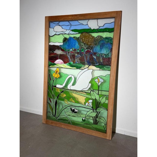 Impressive large decorative stained glass panel depicting an elegant white swan surrounded by lush vegetation, flowers and...