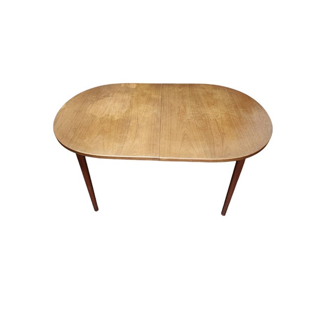 Absolutely stunning MCM Troeds Bjarnum teak dining table in excellent condition. Designed by Nils Johnson, circa 1960s,...