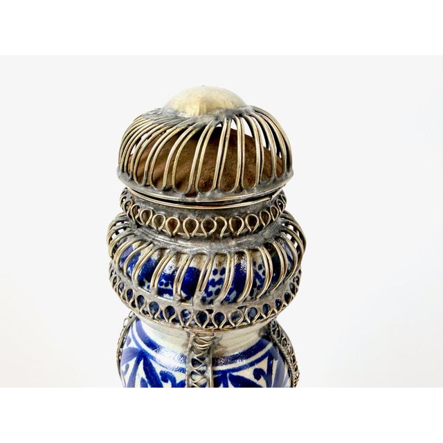 A striking mid-20th-century decorative Moroccan ceramic vessel/flacon, originating from Safi or Fez. The piece features...