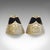 This is a pair of small vintage slipper ashtrays. An Indian, brass cigarette rest in miniature babouche shoe form, dating...