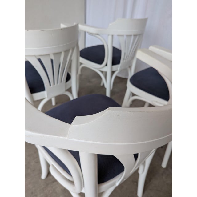 Set of 6 vintage wooden dining chair made in former Yugoslavia in the 1970s. The chair features elegant bentwood...