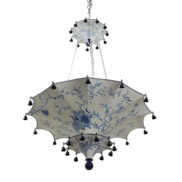 Vintage double-layered inverted umbrella-shaped chandelier with bells, white/blue, Arabic-style design. The umbrella top...