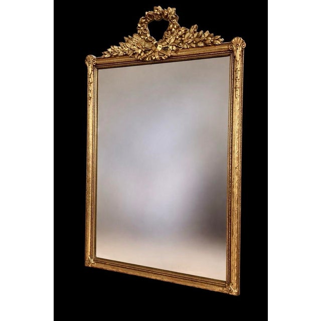 Here's a lovely carved wood and gilded mirror from the 1920's. This is not a reproduction. It is in terrific shape, with...