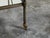 An Italian vintage trolley from the mid 20th century, with patinated metal, mirrored shelves and casters. Created in Italy...