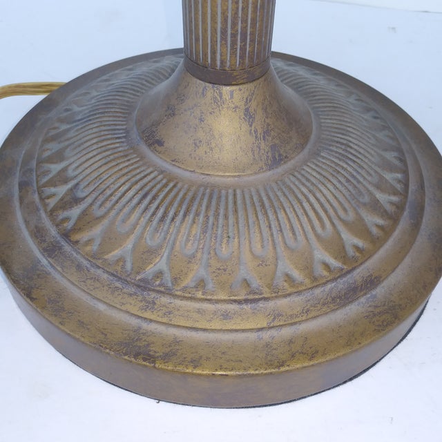 This is a vintage collectible table lamp featuring a dark bronze/brass metal base with a fluted column and a thick and...