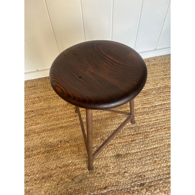 A wonderful blend of rustic French charm and industrial edge, this sturdy stool features a solid wood seat with a warm,...