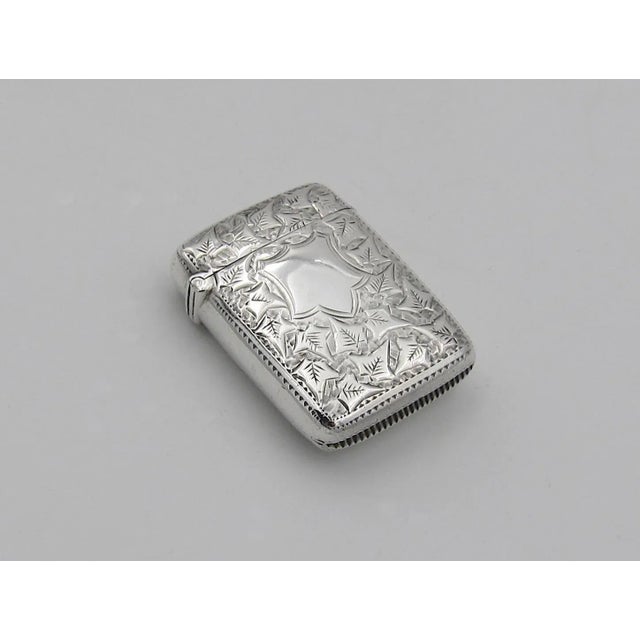 An antique Victorian vesta case match safe in sterling silver by Minshull and Latimer of Birmingham, date marked for 1899....