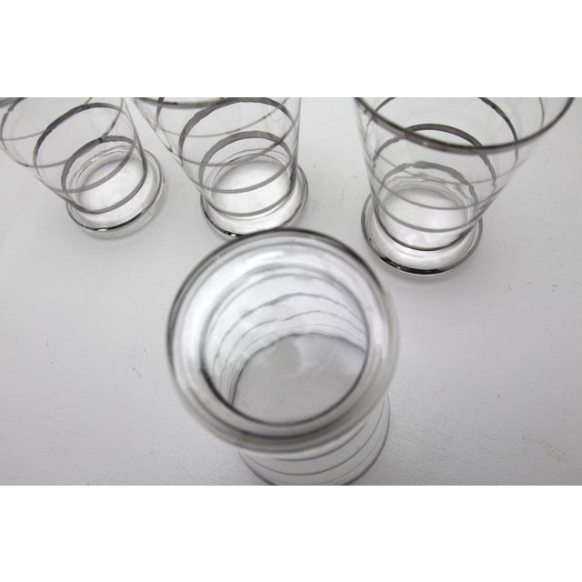 5 elegant art deco blown into the shape drinking cups with silver solder painting and a wide base, capacity 0.3 liters....