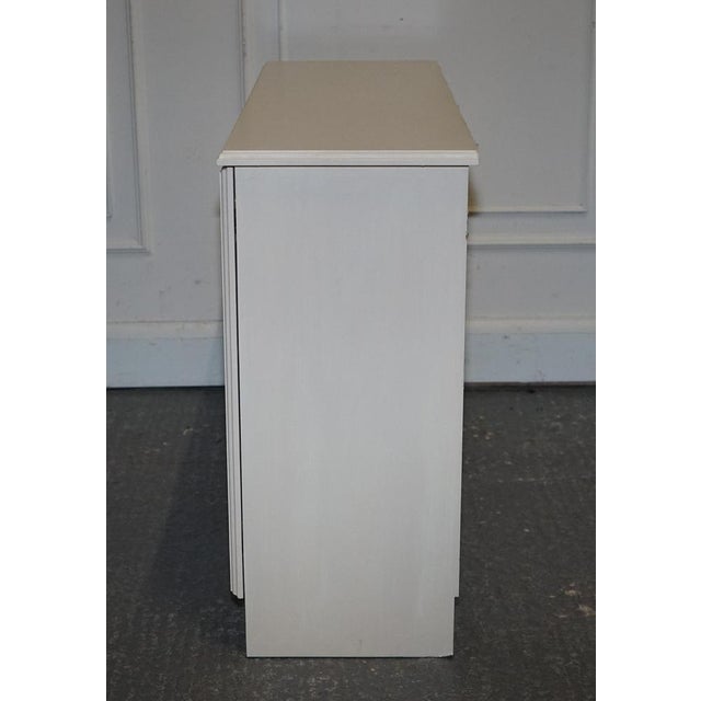Minimalist Painted White Cupboard with Brass Knobs For Sale - Image 11 of 14