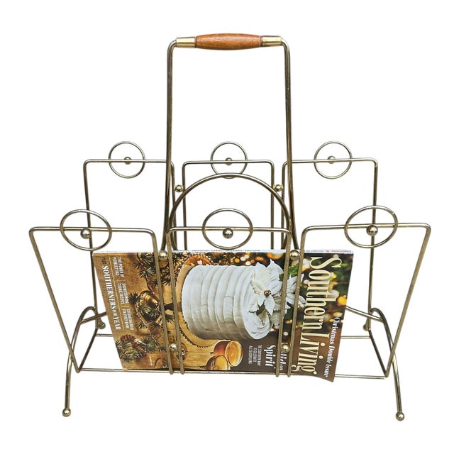 A superb vintage Mid Century Modern style brass magazine rack, circa 1950s. This is a stellar piece that holds a great...