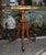 Vintage (1940's) Two Tier Table has a French Style. Made of Wood. Walnut and Exotic Inlaid Woods with a Brass Gallery. The...