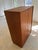 This large wardrobe, crafted from exquisite teak, is a prime example of mid-century German furniture design, bringing...