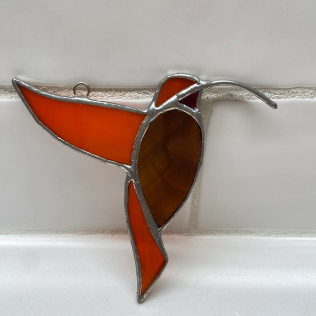Hummingbird stained glass ornament. Very pretty and handmade.