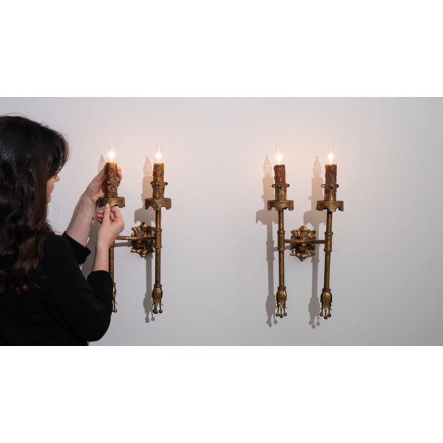 This candelabra makes its impression through aged bronze/gold, dripping candle motif. Originating in France during 1940s,...