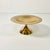 This is a small brass Bob Bon Compote from the Mid-Century. It has an overall smooth brass surface and sits on a pedestal....