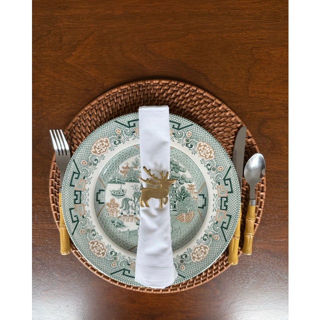 This solid brass set of hand crafted reindeer napkin rings will add patina and warmth to your holiday table setting. The...