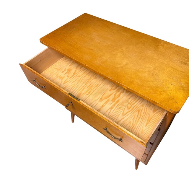 Vintage 1940s-50s mid-century modern four-drawer chest in birch wood attributed to Bodafors, Sweden. Each drawer features...