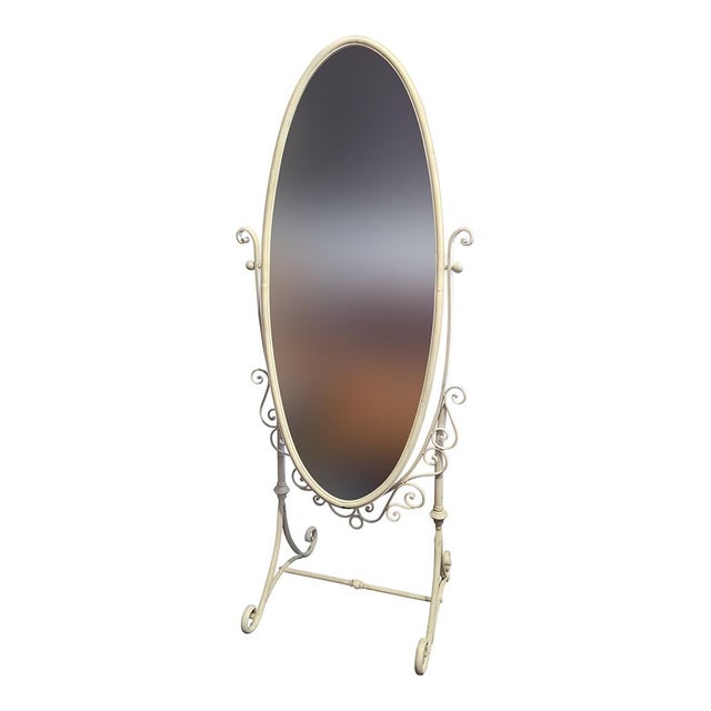 Oval floor mirror, in ivory-colored metal. Dimensions (lxdxh) cm 70 x 177 (134 mirror height)