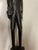 African wood carving out of ironwood. Statue of a tribal man. Stands 14” tall.