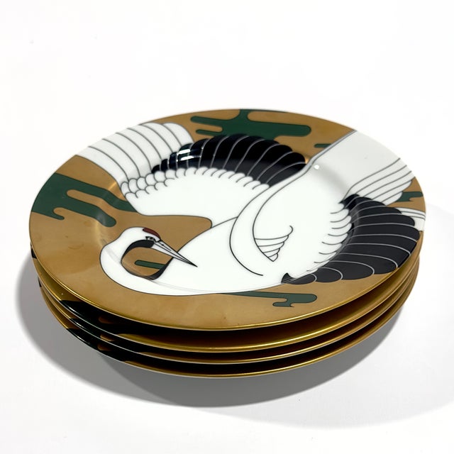 Elevate your tablescape or wall display with this exquisite, rare set of four vintage salad/dessert plates from renowned...