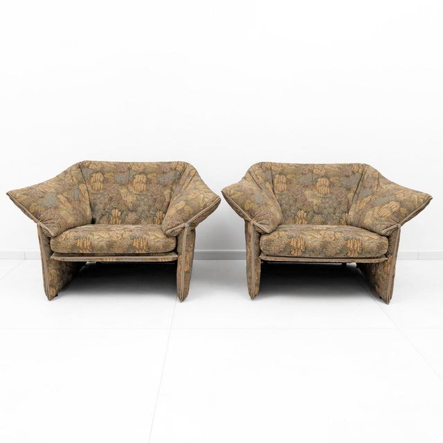 A pair of 1970s armchairs by italian designer mario bellini, produced by b&b italia, model "la stelle." made with a metal...