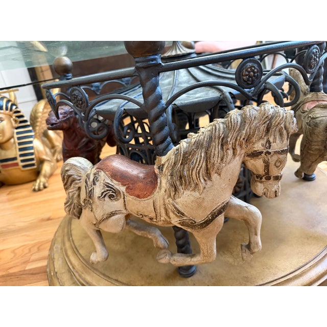 I love this but it doesn't go with my decor. Rotating carousel coffee table — wrought iron canopy base, twisted brass...