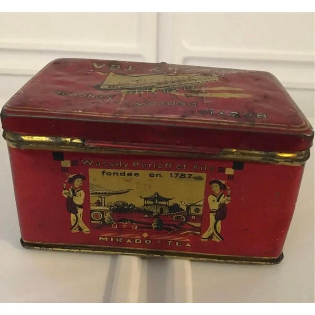 An evocative vintage Mikado Tea advertising tin with vibrant red lithography, produced by Bazyl Perłow i Synowie (Wassily...