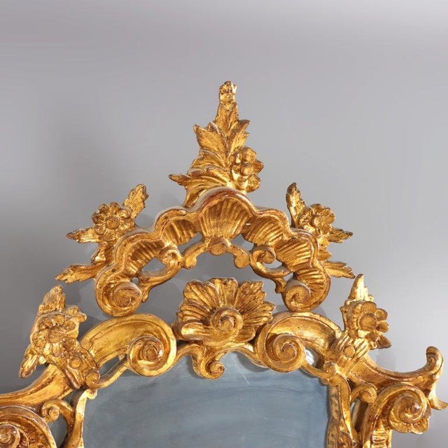 This striking oversized mirror, crafted in France during the 19th century, exemplifies the opulent Louis XIV style. The...