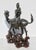 Fine bronze Kylin with a mounting of a Kuan yin with a child. Highly stylized early Qing, with a beautiful carved wooden...