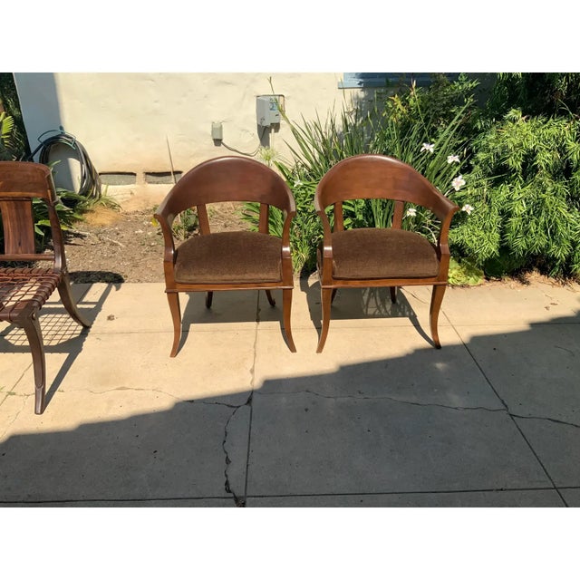 Modern mid century lounge chairs. Chairs are quite unique. Chairs have a walnut finish as well as a brown chenille. Chairs...