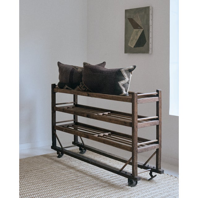 Vintage wooden shoe rack from an old American shoe factory, late 19th Century. This rustic storage piece features a wooden...