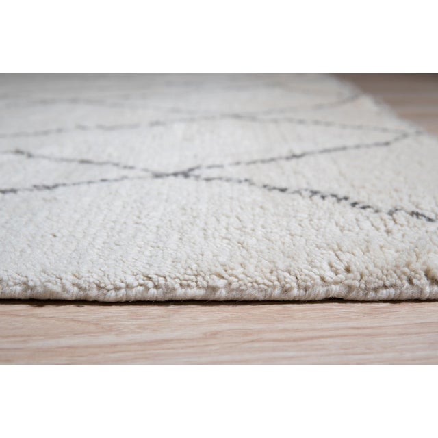 Jade Trellis Beige Hand Knotted Wool Rug, Country of Origin: India. This exceptional piece blends traditional hand-...