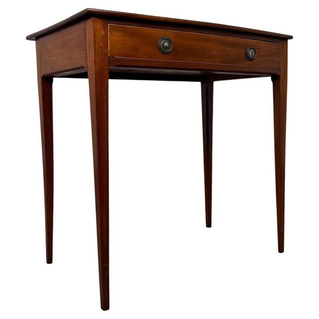 A refined and beautifully proportioned 18th-century Georgian mahogany writing table, combining elegant simplicity, fine...