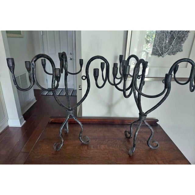 Pair of Vintage Hand-Wrought Iron Sculptural Candelabra A sculptural pair of vintage wrought iron candelabra with strong...