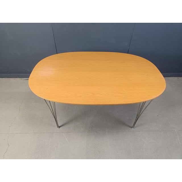 Vintage superellipse dining table designed by Bruno Mathsson and Piet Hein in the 1960s for Fritz Hansen. The table has...