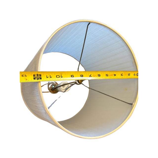 A striking vintage table lamp by Alys featuring a richly textured deep blue ceramic body accented with a polished brass...