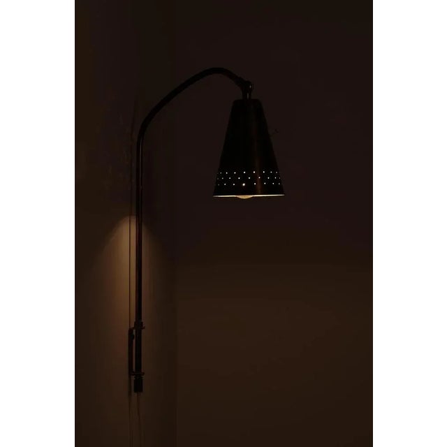 Designed by Alf Svensson, Sweden, 1950s. Produced by Bergboms. Perforated brass with beautiful patina. New wiring. This...